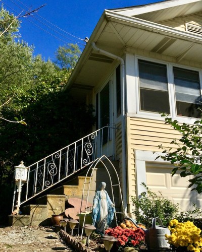 Mary statuette in front of house, Eastvale, PA