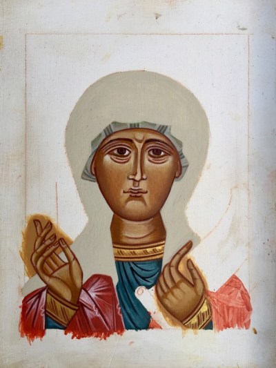 partial icon for St. Praskevia with only the face and hands painted