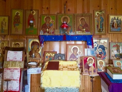 wall with dozens of traditional Russian Orthodox icons painted by Simeon Larivonovoff