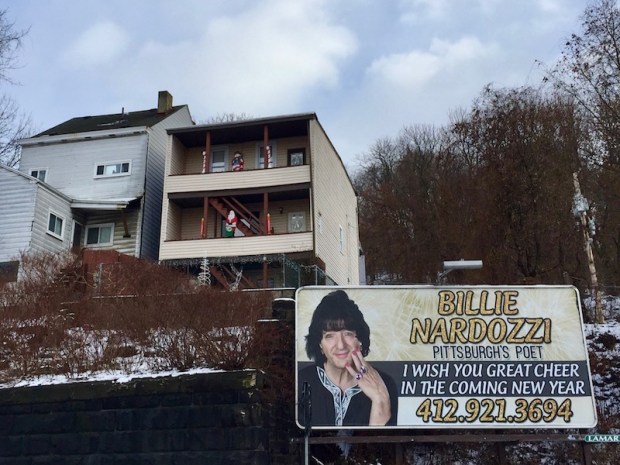 billboard with Billie Nardozzi's picture and the text "I wish you great cheer in the coming new year," Pittsburgh, PA