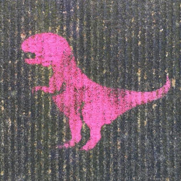 stencil image of pink tyrannosaurus rex painted on concrete wall, Pittsburgh, PA