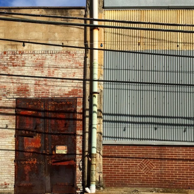 weathered brick and sheet metal factory wall, Etna, PA
