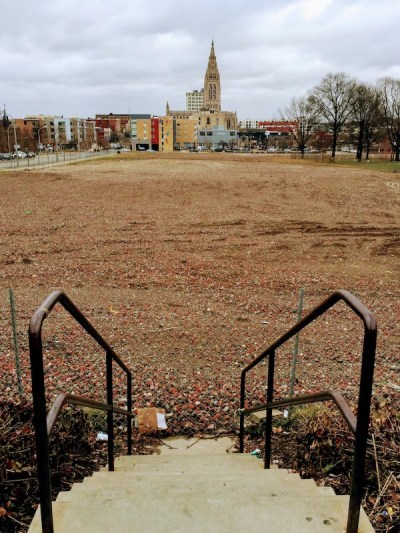 stairway leading down to large empty lot