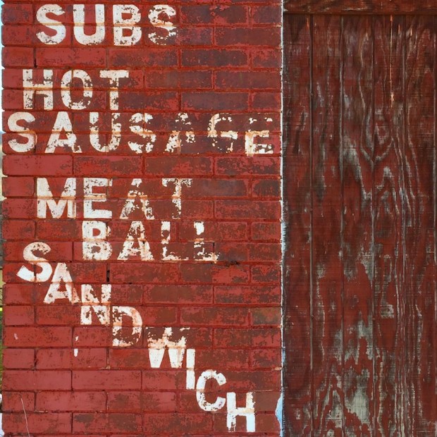 brick wall of former hoagie shop painted with "Subs," "Hot Sausage," Meat Ball," "Sandwich," Johnstown, PA