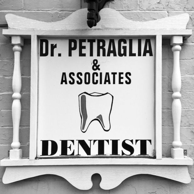 wooden sign for Dr. Petraglia & Associates dentist office, Pittsburgh, PA