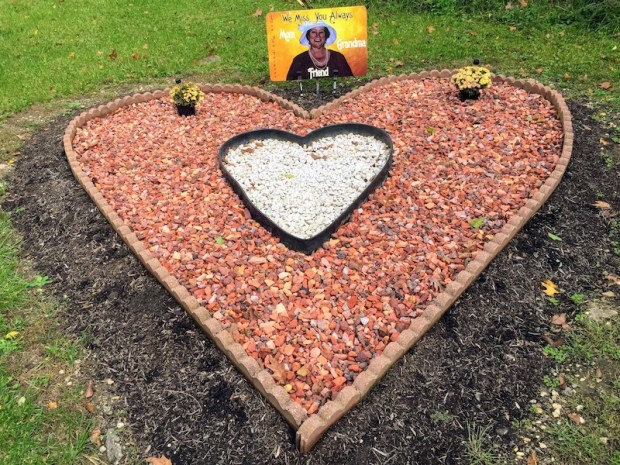 roadside memorial heart with sign