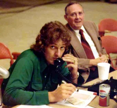 Danny McGibbeny on telephone at World Team Tennis match in the 1970s