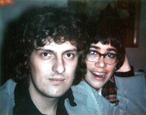 two young men look at the camera