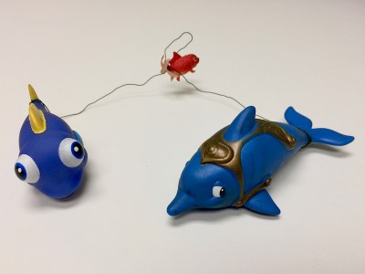 3 toy fish connected by wire