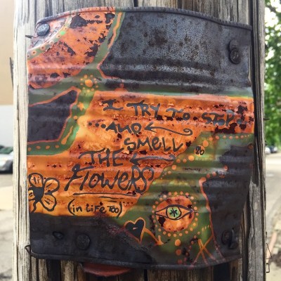 steel can with painting nailed to utility pole, Pittsburgh, PA