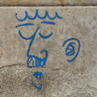 graffiti of man's face with bushy mustache on stone wall, Pittsburgh, PA