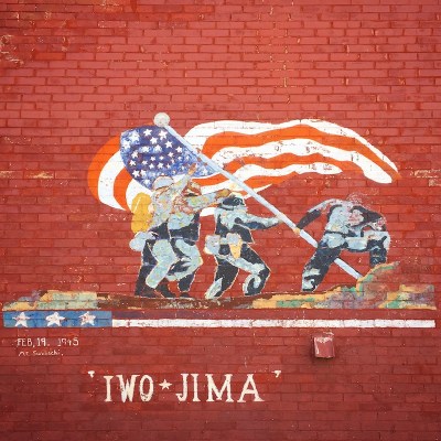 mural of American soldiers raising flag at Iwo Jima painted on red brick wall of house in Johnstown, PA
