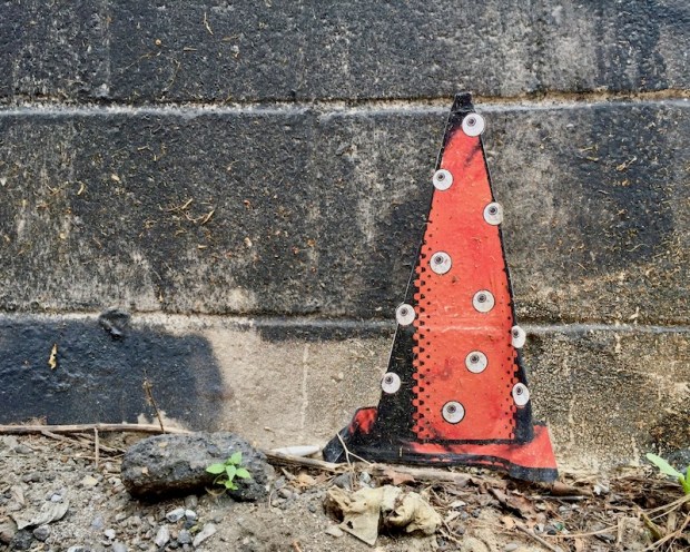 wheatpaste traffic cone on cinderblock wall, Pittsburgh, PA