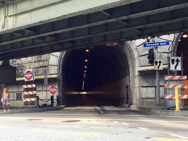 exterior of Armstrong Tunnel with rising highway structure above, Pittsburgh, PA