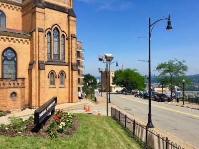 street with large church and city view in PIttsburgh, PA