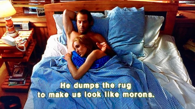 scene from "Striking Distance" with Bruce Willis and Sarah Jessica Parker talking in bed
