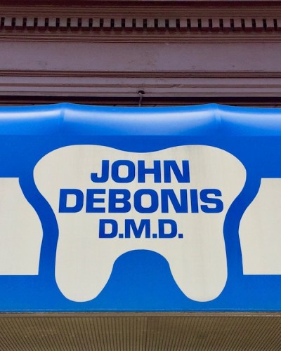 awning for dentist John Debonis with tooth-shaped logo, Bellevue, PA