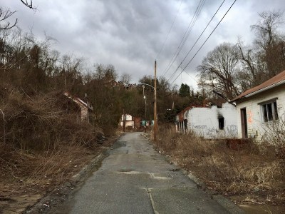 single-lane residential street with abandoned houses, Clairton, PA
