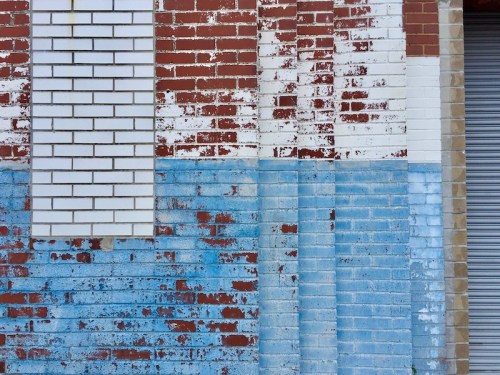 brick wall with worn paint job in several different levels, Clairton, PA