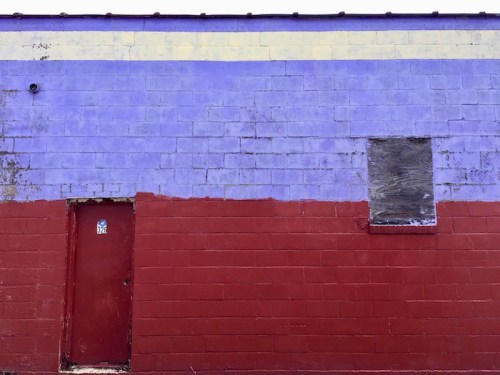 cinderblock wall painted red and blue with a white stripe, Clairton, PA