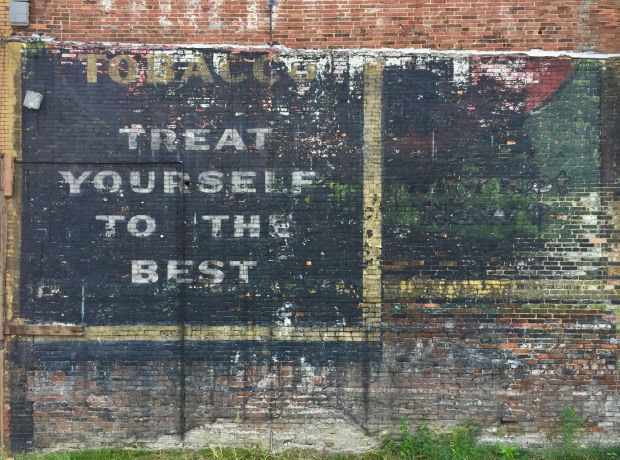 brick with layers of "ghost signs" overlapping, Clairton, PA