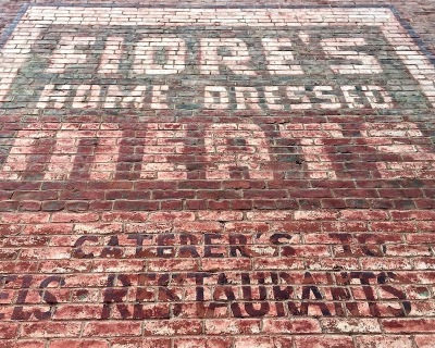 painted sign for Fiore's Home Dressed Meats on brick wall, Pittsburgh, PA
