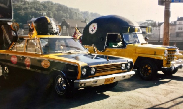 two classic cars decorated in tribute of the Pittsburgh Steelers