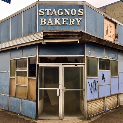 run down exterior of former retail shop for Stagno's Bakery, Pittsburgh, PA