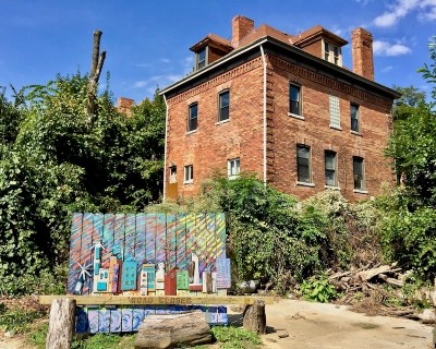 colorful public art piece of town made with scrap wood, Bellevue, PA
