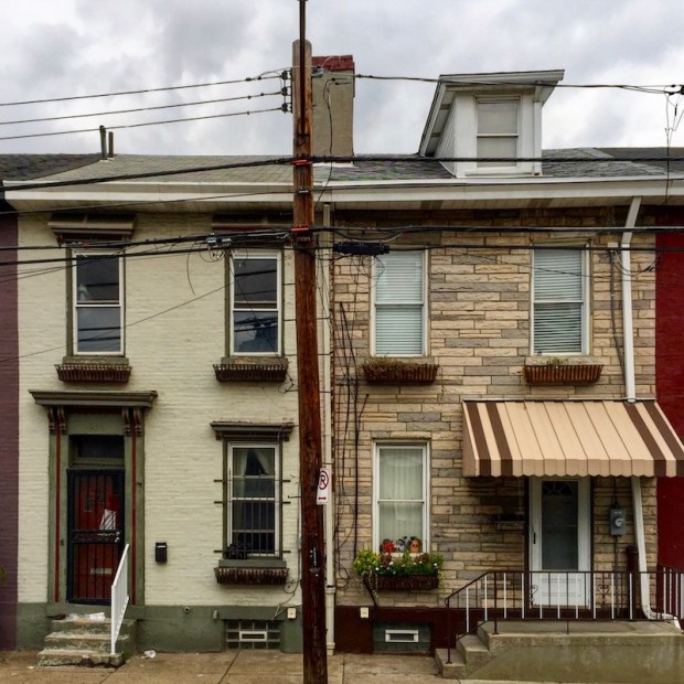 exterior of mirror-image row houses with many cosmetic differences, Pittsburgh, PA
