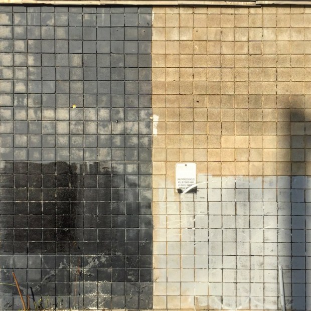 cinderblock wall sectioned into rough quarters by paint, Pittsburgh, PA