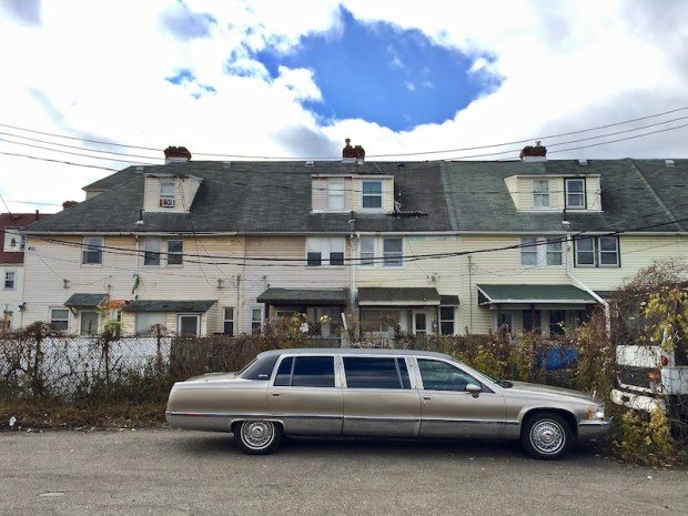 silver stretch limousine parked by row houses, Blawnox, PA