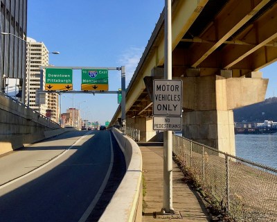 traffic sign reading "Motor vehicles only: no pedestrians" on Mon Wharf bicycle/pedestrian path in downtown Pittsburgh, PA