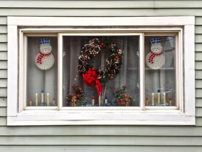 rowhouse window decorated for Christmas, Pittsburgh, PA