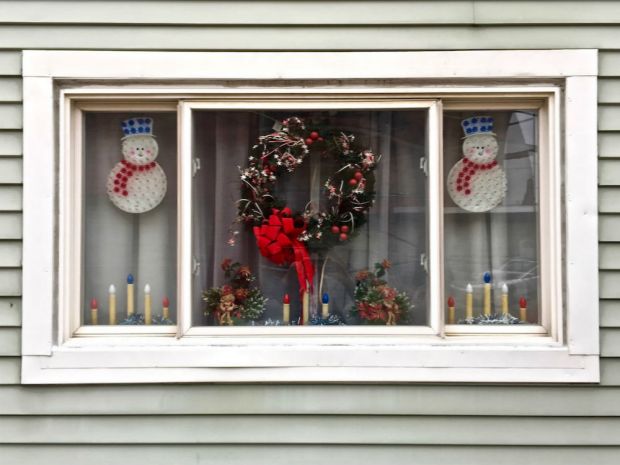 rowhouse window decorated for Christmas, Pittsburgh, PA