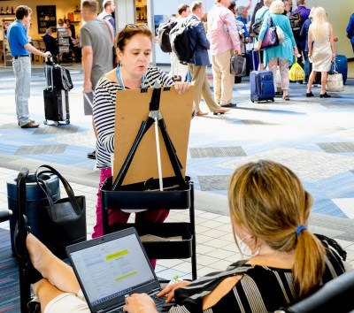 Artist Kirsten Ervin working on an "Air Portrait"