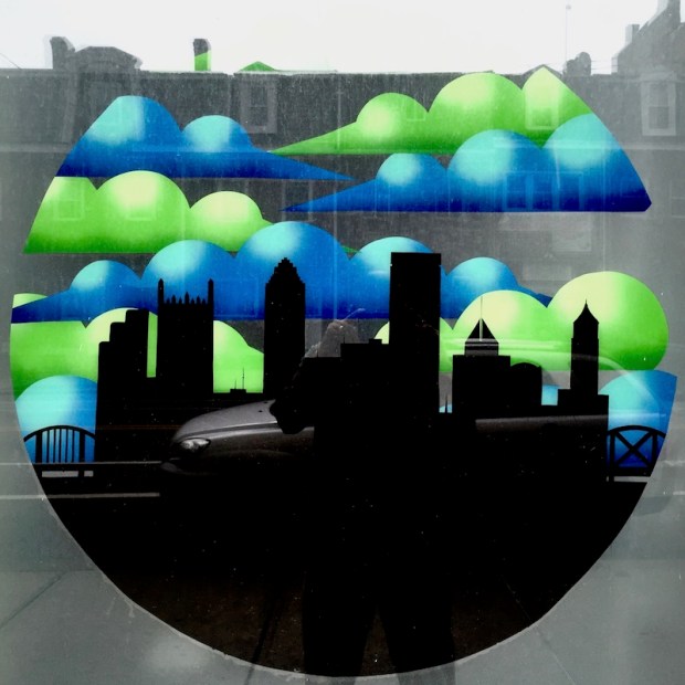 storefront window image including Pittsburgh skyline