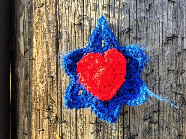crochet Star of David with heart hanging from utility pole, Pittsburgh, PA