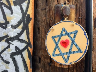 wooden disc with Star of David hanging on utility pole, Pittsburgh, PA