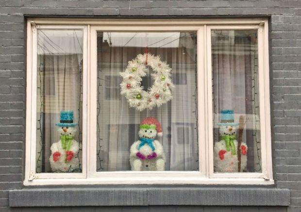 window decorated with snow people and Christmas wreath, Pittsburgh, PA