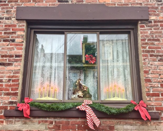 row house window decorated for Christmas, Pittsburgh, PA