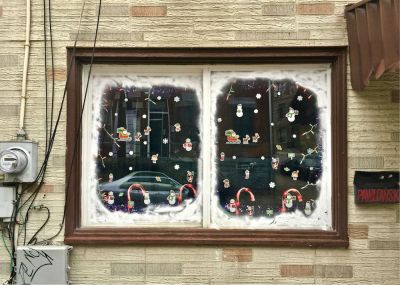 row house window decorated for Christmas, Pittsburgh, PA