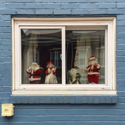 row house window decorated for Christmas, Pittsburgh, PA