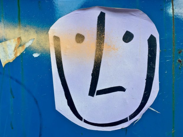 homemade sticker with simple drawing of face on dumpster, Pittsburgh, PA