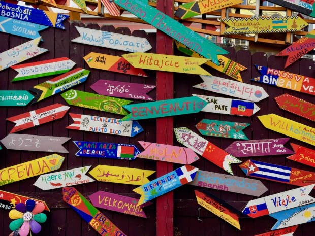 handmade welcome signs in many different languages at Randyland, Pittsburgh, PA
