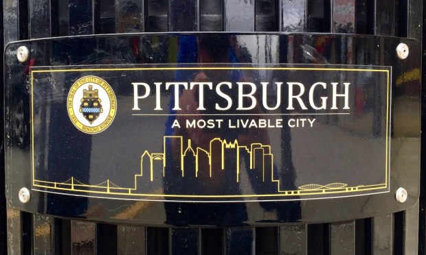 waste bin plaque including the Pittsburgh skyline