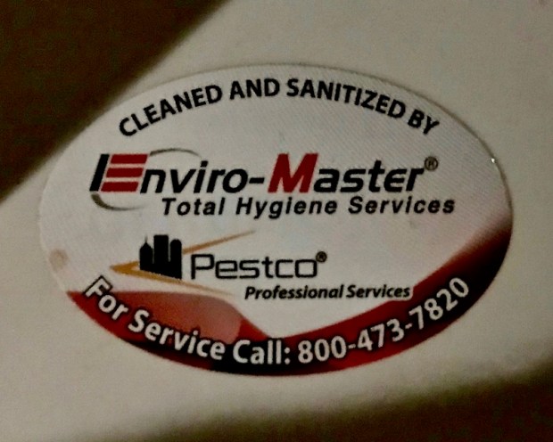 sticker on urinal with image of downtown Pittsburgh skyline