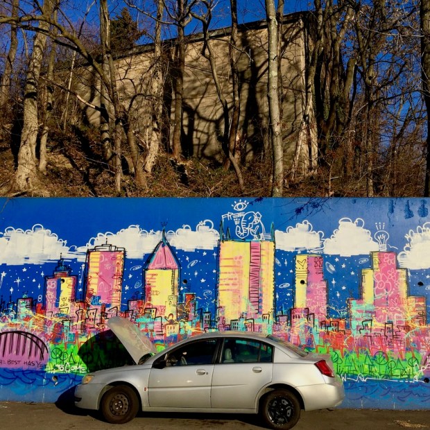 mural by Baron Batch depicting cartoonish, colorful version of downtown Pittsburgh skyline