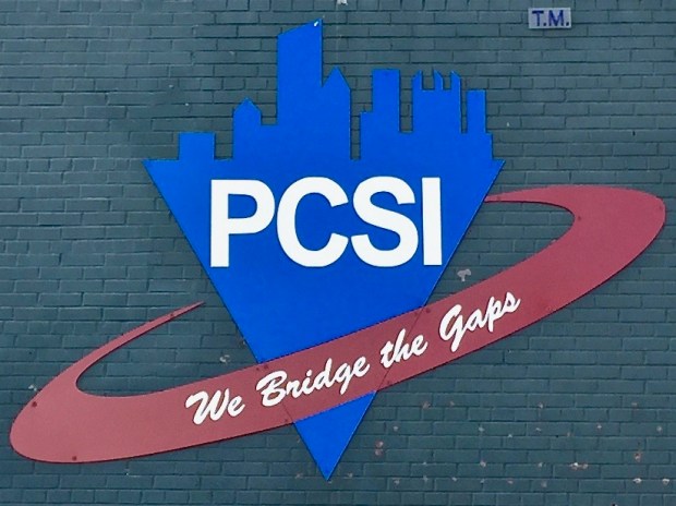 sign for Pittsburgh Community Services including the Pittsburgh skyline