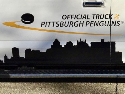 Pittsburgh skyline on side of Ford truck with the message "the Official Truck of the Pittsburgh Penguins"